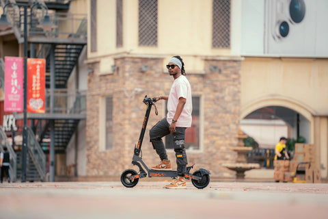 Rider using a KuKirin electric scooter on an urban commuting route
