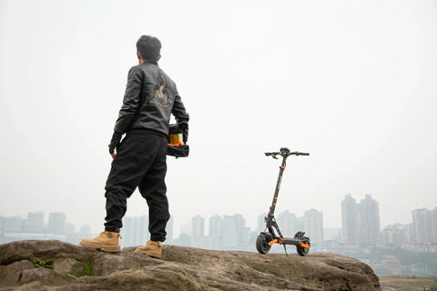 KuKirin electric scooter rider traveling through a European city