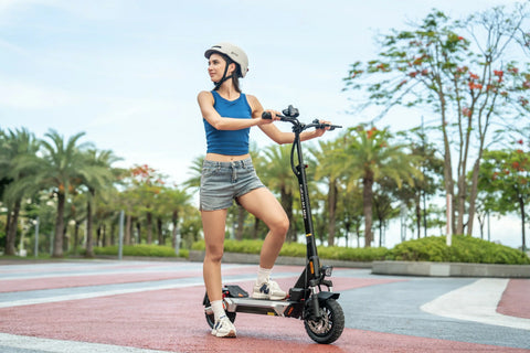 rider using KuKirin electric scooter during daily city commute