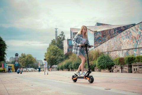 KuKirin G2 Pro electric scooter parked outside urban coffee shop