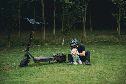 KuKirin electric scooter rider during morning city commute