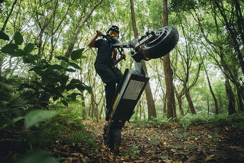 KuKirin electric scooter rider enjoying countryside road adventure