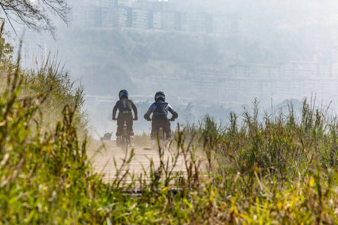 KuKirin electric bike riding through countryside road